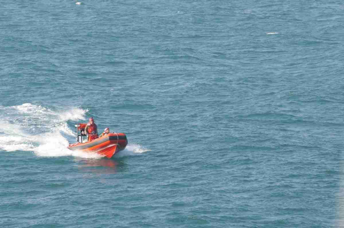 Army personnel on boat with Killer Tomato® target
