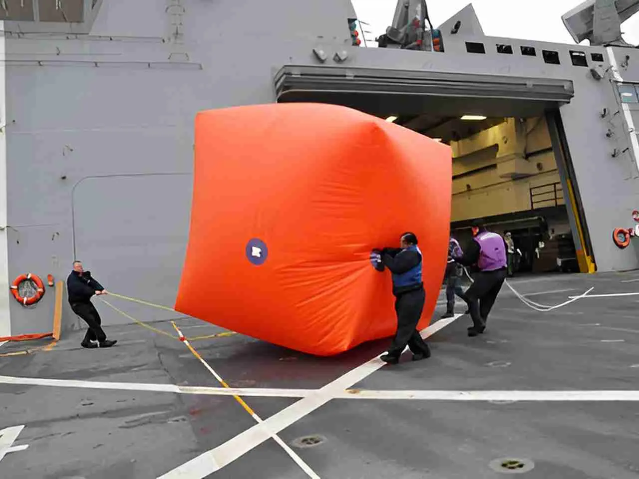 Standard Killer Tomato® inflatable target balloon — International Orange, deployed at sea